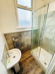 A Modern And Clean Bathroom Featuring A Spacious S...