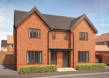 A Modern Brick Semi-Detached House With Manicured Hedges In The Foreground Stands Against A Clear Bl