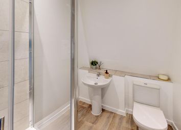 A Modern And Clean Bathroom Featuring A Spacious S...