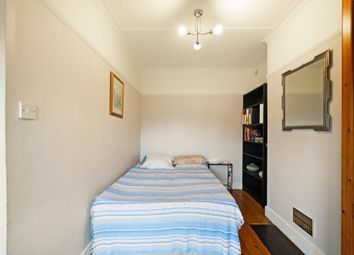 Cozy Single Bedroom Featuring A Neatly Made Bed Wi...