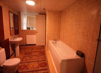 A Spacious Bathroom Suite Featuring A Full Bathtub...