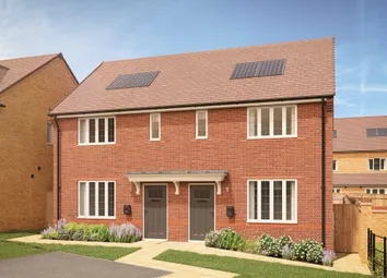 Two Modern Brick Semi-Detached Houses With Solar Panels Stand Under A Clear Blue Sky