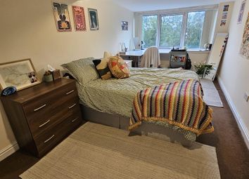 A Spacious And Well-Lit Master Bedroom Featuring A...