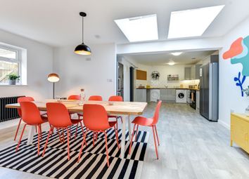 Bright And Modern Kitchen Featuring A Spacious Din...