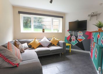 This Cozy Living Room Features A Stylish Grey Sofa...