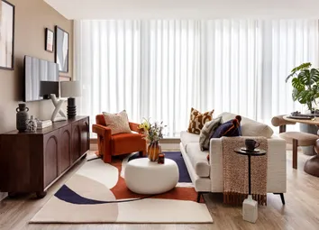 Floor To Ceiling Windows Flood The Open Plan Living Area With Natural Light