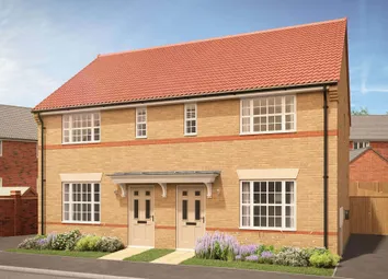 A Modern Beige Brick Semi-Detached House With A Red Tiled Roof Stands In The Foreground