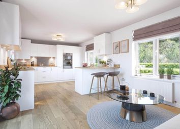 A Bright And Airy Kitchen And Dining Area Leads Through Double Doors To The Garden