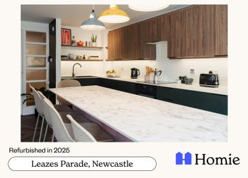 Modern, Well-Lit Kitchen Featuring A Sleek White c...