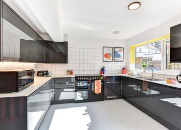 Modern And Well-Lit Kitchen With Sleek Black Cabin...