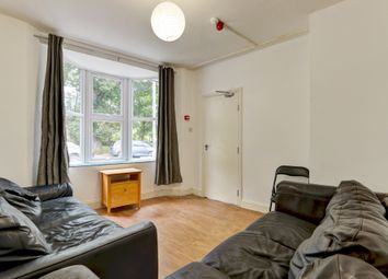 Bright And Inviting Living Room Featuring Ample Na...