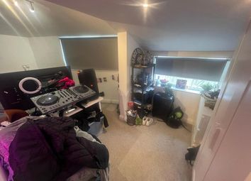 A Cozy Room With A Dj Setup, Offering A Creative S...