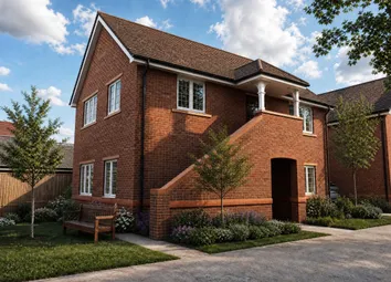 A Modern Brick House With A Porch And A Bench In The Foreground Sits Under A Cloudy Blue Sky.