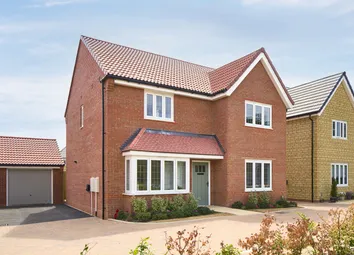 A Modern Red Brick House With A Bay Window And A Garage Sits On A Paved Driveway