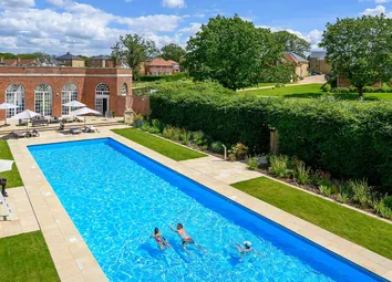 An Image Of People Using The Outdoor Swimming Pool At The Lawn Club
