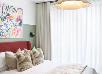 Bed With Contemporary Design, Decorated In Beige And Green Tones, Bedside Tables And Tall Window