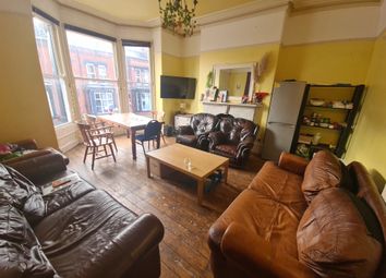 A Spacious And Inviting Living Room Featuring Mult...