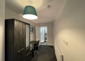 A Clean And Cozy Single Bedroom With A Dark Wardro...