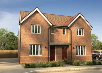 A Two-Story Brick House With A Red Tile Roof