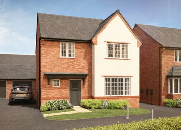 A Modern Brick And Stucco House With A Dark Garage And A Car Sits On A Manicured Lawn In Front Of A