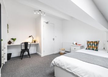 A Bright, Neatly Presented Bedroom Featuring A Com...