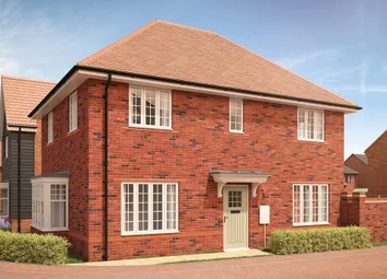 A Red Brick House With White-Framed Windows And A Light Green Door Stands In The Foreground