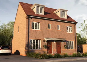 A Two-Story Brick House With A Red Tile Roof