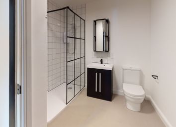 Modern Bathroom Featuring A Walk-In Shower With Bl...