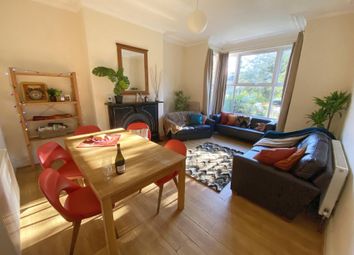 Bright, Well-Furnished Living Room With A Large Fr...