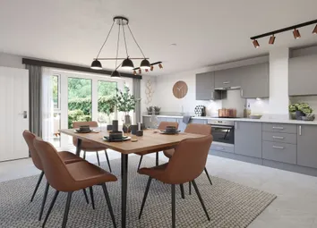 A Modern Kitchen With French Doors Opening To The Rear Garden