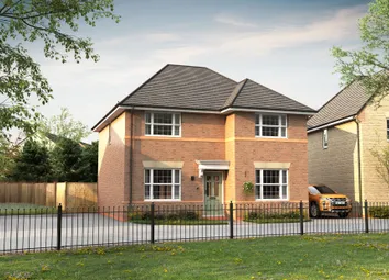 A Modern Brick House With A Green Door Stands Behind A Black Metal Fence In The Foreground