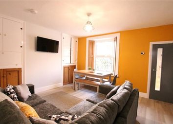 A Bright And Inviting Large Modern Living Room Wit...