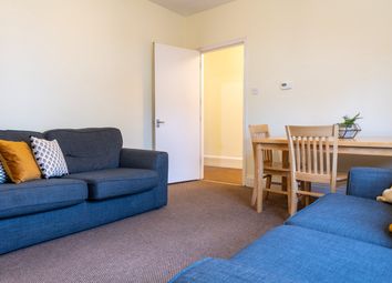 A Bright And Inviting Living Room Featuring Comfor...