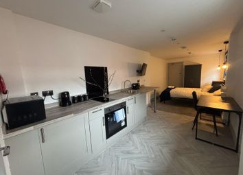 Modern Kitchenette Featuring Sleek Cabinetry And A...