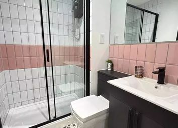 Bright And Modern Bathroom Featuring A Sleek Black...