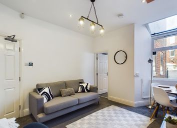 A Bright And Inviting Living Room Perfect For Soci...