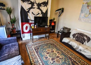 Cozy Living Room Featuring A Comfortable Sofa, A F...