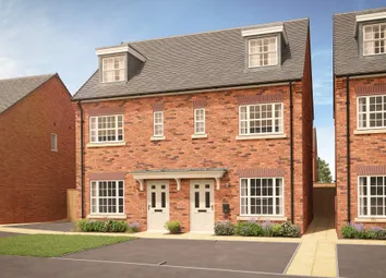 A Pair Of Red Brick Semi-Detached Houses With Dormer Windows And White Doors Stand In The Foreground