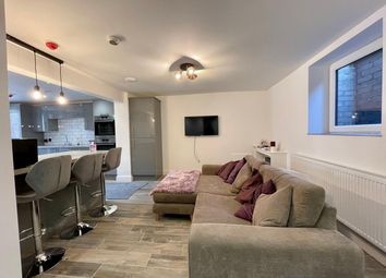 Spacious And Inviting Living Room Featuring A Comf...