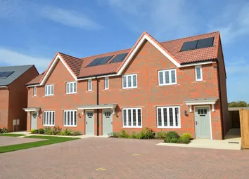 Modern Red-Brick Houses With Solar Panels Stand Behind A Paved Driveway And Neatly Trimmed Green Law