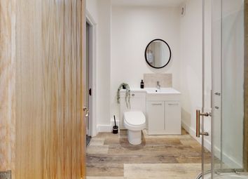 A Modern And Clean Bathroom Featuring Stylish Fixt...