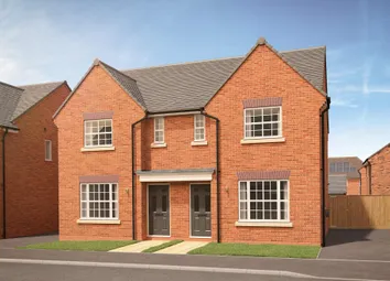 A Pair Of Modern Brick Semi-Detached Houses With Grey Doors And White-Framed Windows Stand On A Pave