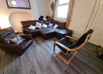 A Spacious And Inviting Living Room Featuring Comf...