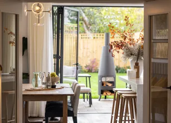 Kitchen Opening Onto A Private Garden Through Bi-Folding Doors