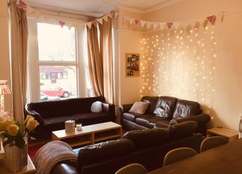 Warm, Inviting Living Room With Comfortable Leathe...