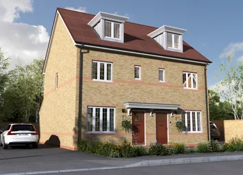 A Modern Beige Brick Semi-Detached House With Red Doors And Dormer Windows Stands In The Foreground