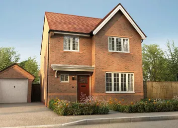 A Two-Story Brick House With A Red Tile Roof, Surrounded By A Garden And A Garage