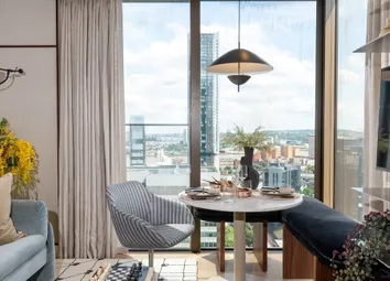Modern Living Room With Sofa, Wall-Mounted TV And Dining Table Beside Floor-To-Ceiling Windows