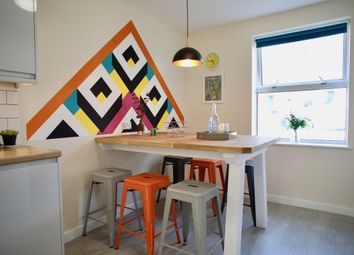 A Vibrant Kitchen Featuring A Modern Design With c...
