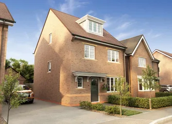 A Multi-Story Brick Residential Building With A Sloped Roof And Dormers
